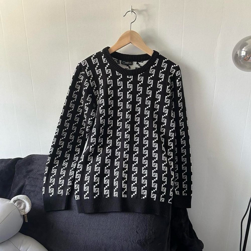 Black and white patterned knit sweater